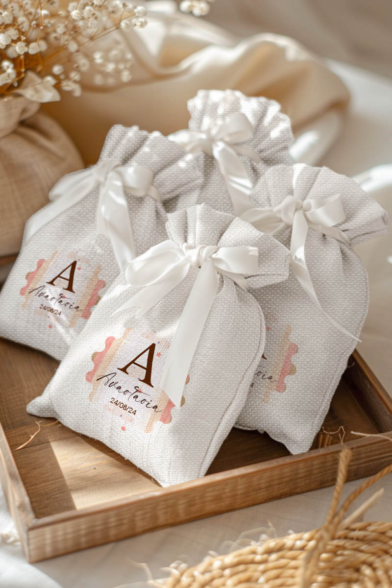 Μπομπονιέρες Βάπτισης Πουγκί σε Λευκό Χρώμα με Σχέδιο Ροζ Ουράνιο Τόξο